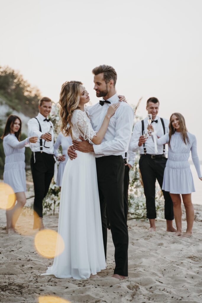beautiful-bride-groom-having-their-wedding-with-guests-beach